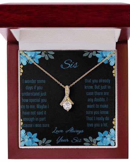 Alluring Beauty Necklace with a yellow gold variant on a to sis from sis greeting card inside a mahogany box with a close up view.