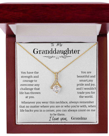 a yellow gold alluring beauty necklace up close in a mahogany box