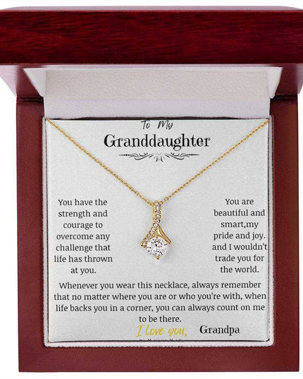a yellow gold alluring beauty necklace up close in a mahogany box