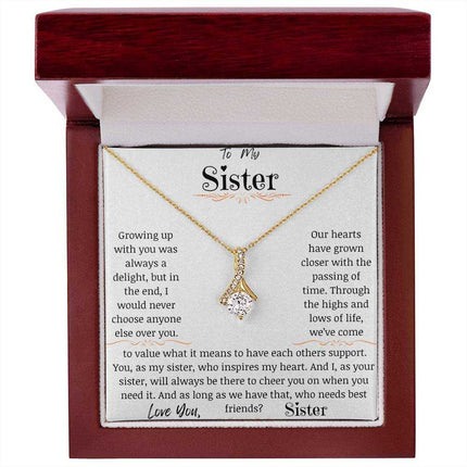 a yellow gold alluring beauty necklace in a mahogany box
