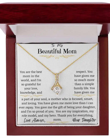 a yellow gold alluring beauty necklace in a mahogany box up close