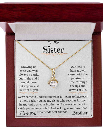 a yellow gold alluring beauty necklace up close in a mahogany box.