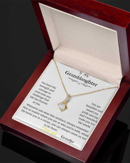 a yellow gold alluring beauty necklace in a mahogany box angled right