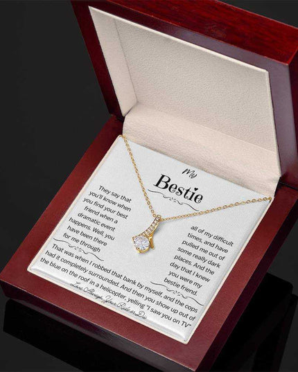 a yellow gold alluring beauty necklace in a mahogany box angled right