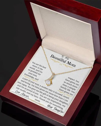 a yellow gold alluring beauty necklace in a mahogany box angled right