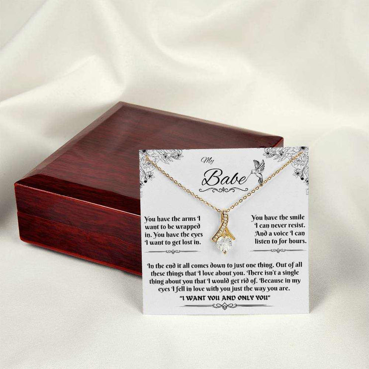 yellow gold alluring beauty necklace on a message card outside of box