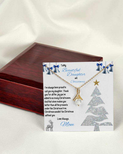 yellow gold alluring beauty necklace on top of a closed luxury box