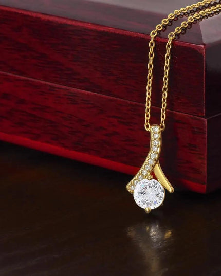 yellow gold alluring beauty necklace on top mahogany box