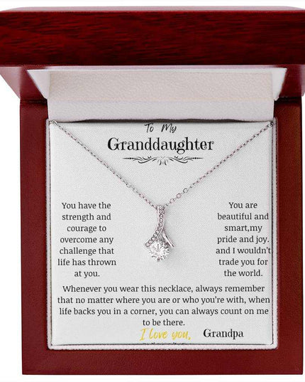 a white gold alluring beauty necklace up close in a mahogany box