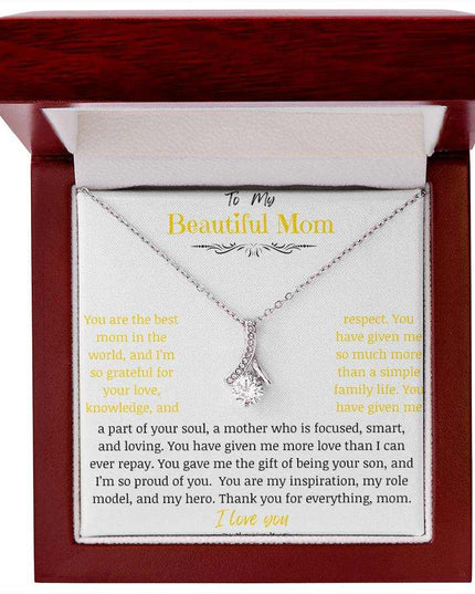 A white gold Alluring Beauty Necklace in a mahogany box.