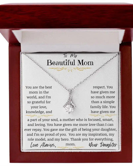 a white gold alluring beauty necklace up close in a mahogany box