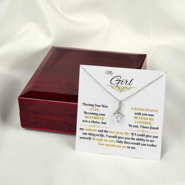 white gold alluring beauty necklace on a message card beside a luxury box