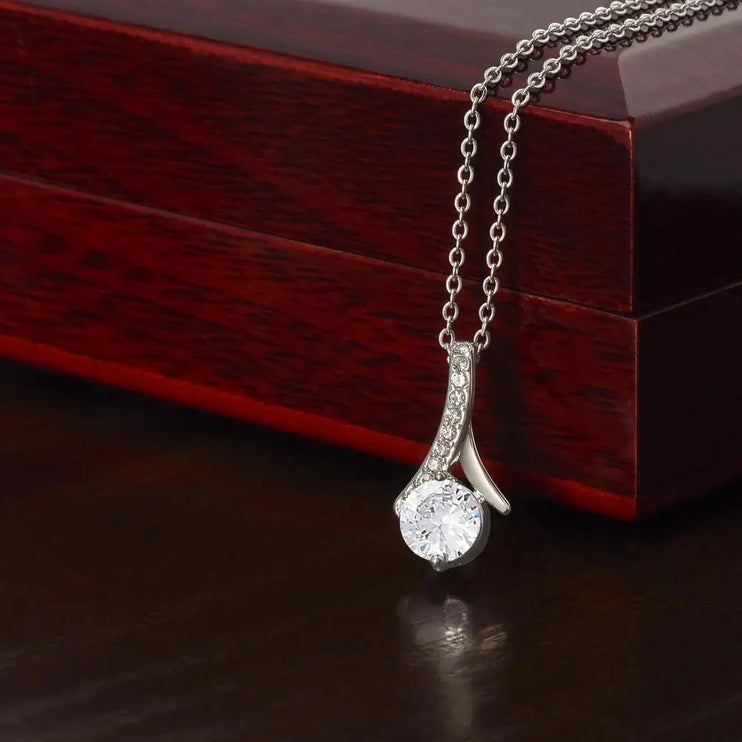 white gold alluring beauty necklace on a mahogany box