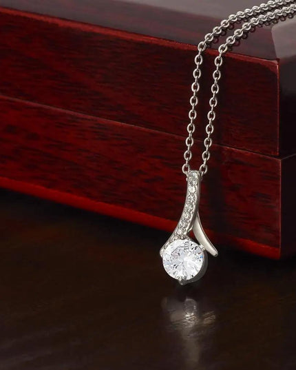 white gold alluring beauty necklace on top of mahogany box