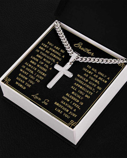 A artisan cross personalized cuban link chain in a two-tone box with a to brother greeting card