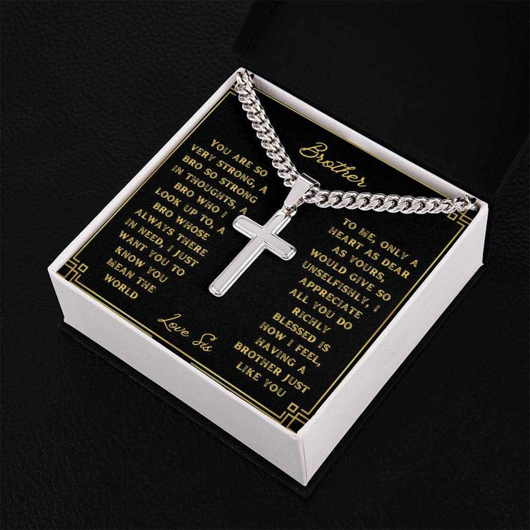 A artisan cross personalized cuban link chain in a two-tone box with a to brother greeting card