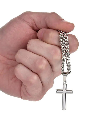 personalized cross on cuban link chain in model's hand