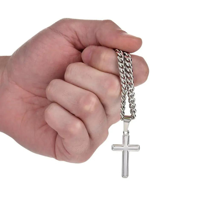 personalized cross on cuban link chain in model's hand