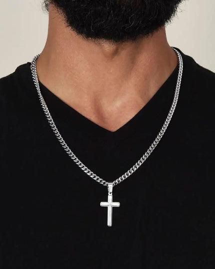 personalized cross on cuban link chain on model's neck