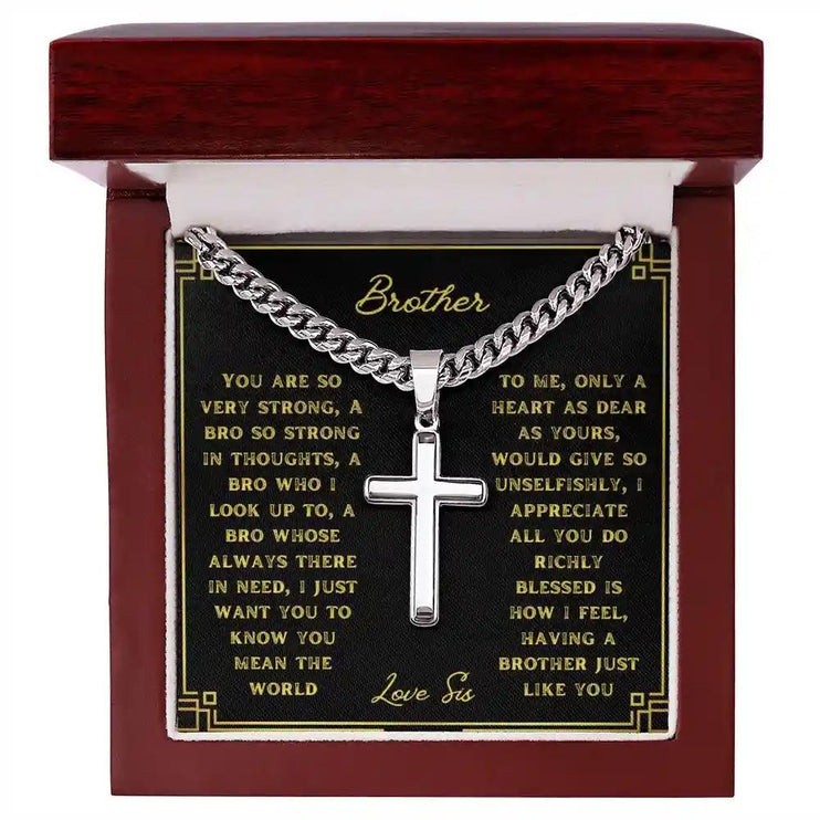 A artisan cross personalized cuban link chain in a mahogany box with a to brother greeting card