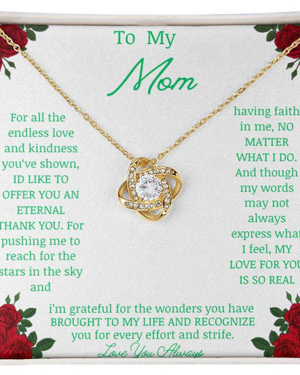 Love Knot Necklace with yellow gold pendant in a two-tone box angle 3