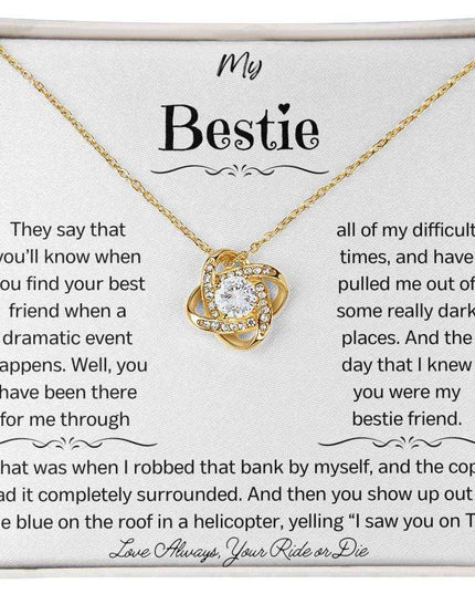 a yellow gold love knotnecklace up close.