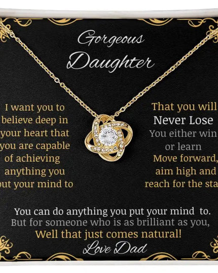 Love Knot Necklace with a yellow gold charm in a two-tone box angle 1