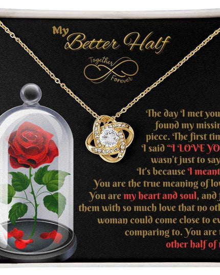 18k gold love knot necklace in soft box up close