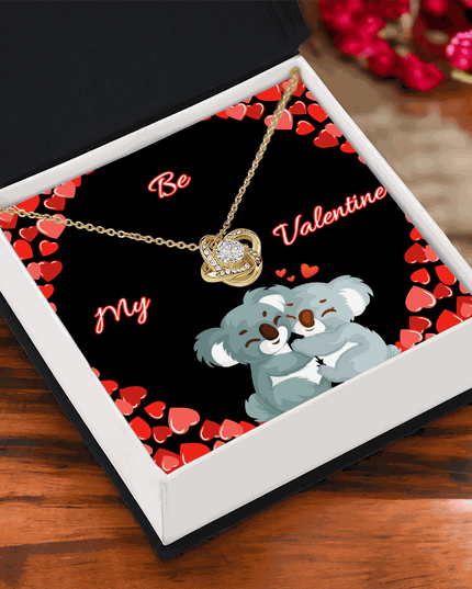 18k gold love knot necklace in a soft box