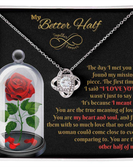 14k white gold love knot necklace in soft box up close