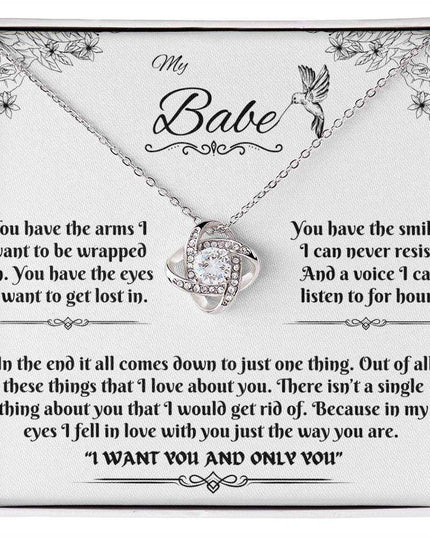 white gold love knot necklace in soft box up close