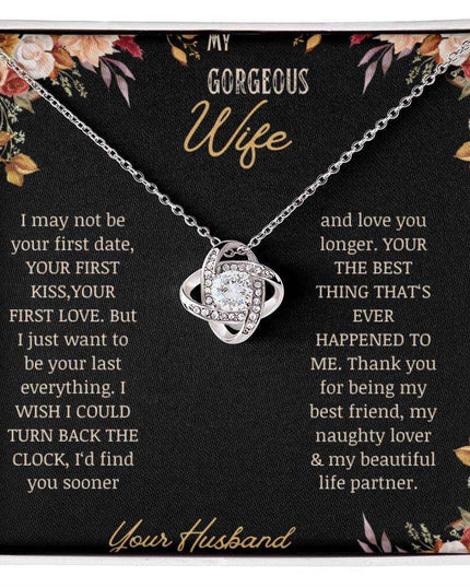 A white gold love knot necklace on a to wife greeting card