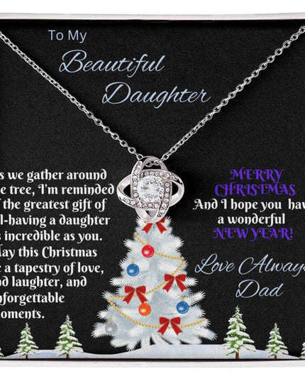 white gold love knot necklace in soft box birds eye view
