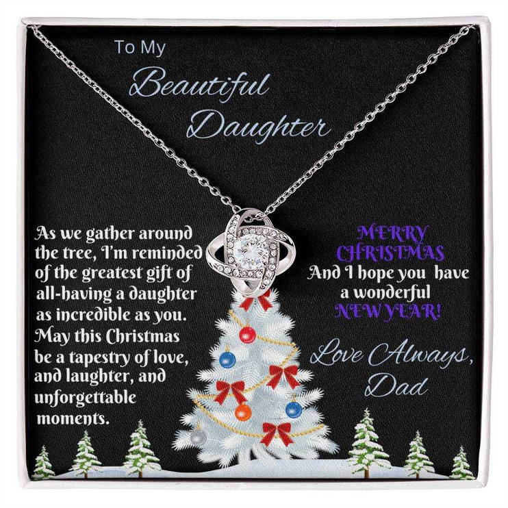 white gold love knot necklace in soft box birds eye view