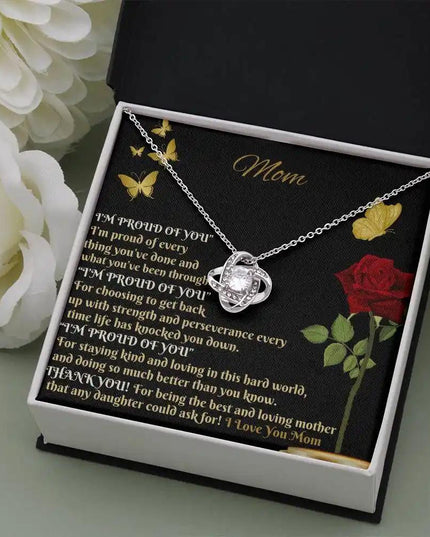 white gold love knot necklace in two-tone box angled right