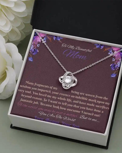 white gold love knot necklace in soft box angled right