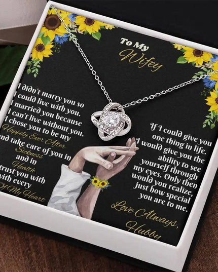 white gold love knot necklace in two-tone box angled right