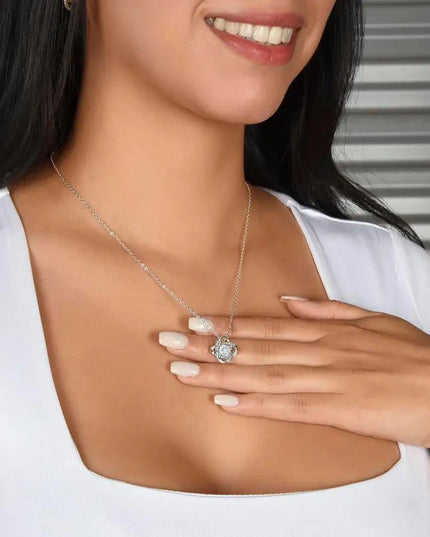 white gold love knot necklace on model's neck