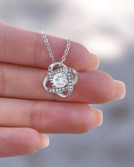 Love Knot Necklace on a model's hand