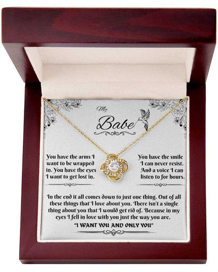 yellow gold love knot necklace in luxury box up close
