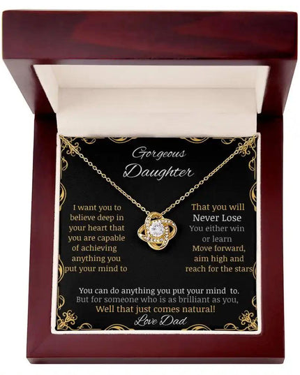 Love Knot Necklace with a yellow gold charm in a mahogany box angle 1