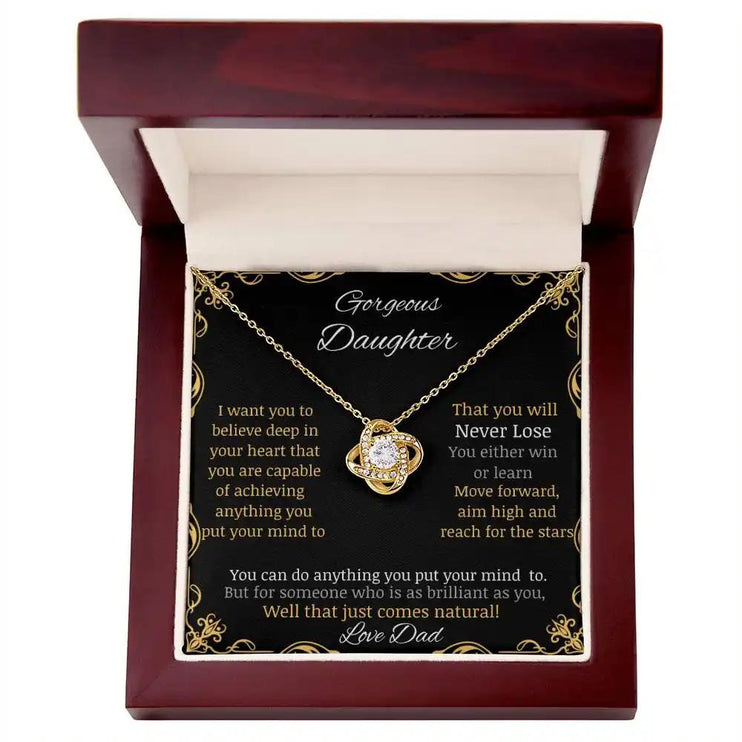 Love Knot Necklace with a yellow gold charm in a mahogany box angle 1