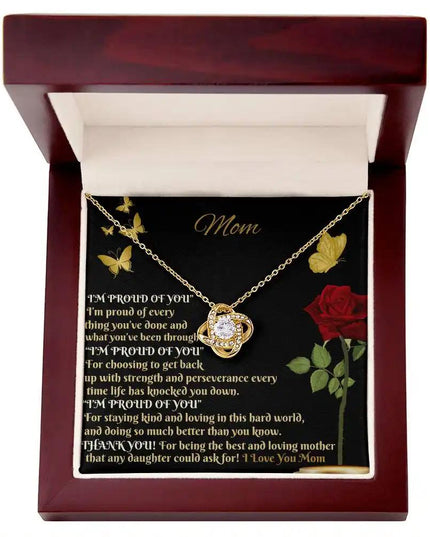 yellow gold love knot necklace in mahogany box