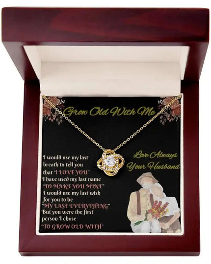 yellow gold love knot necklace in mahogany box