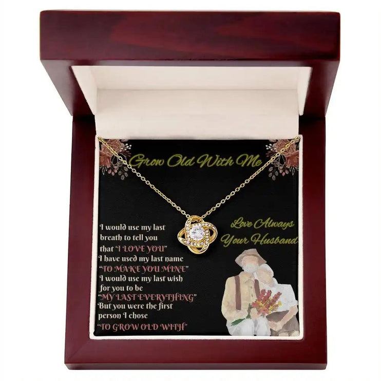 yellow gold love knot necklace in mahogany box