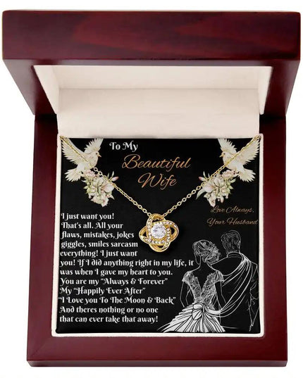 yellow gold love knot necklace in a mahogany box