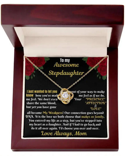 yellow gold love knot necklace in a mahogany box