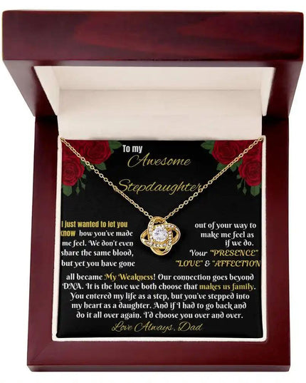 yellow gold love knot necklace in a mahogany box
