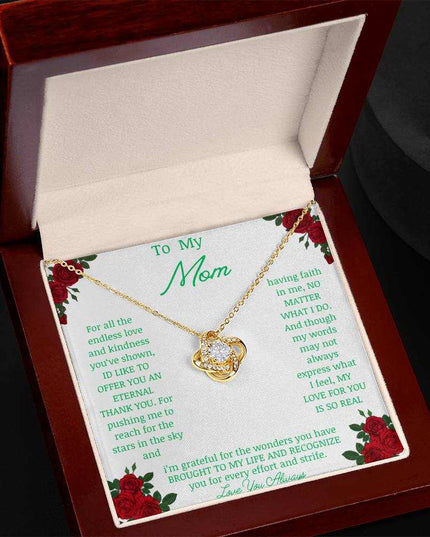 Love Knot Necklace with yellow gold pendant in a mahogany box angle 3