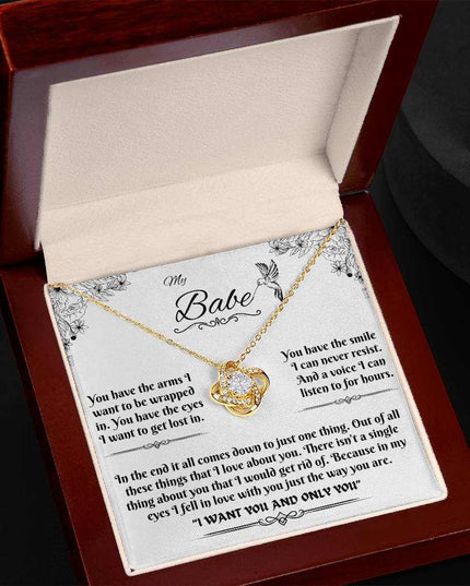 yellow gold love knot necklace in luxury box angled left
